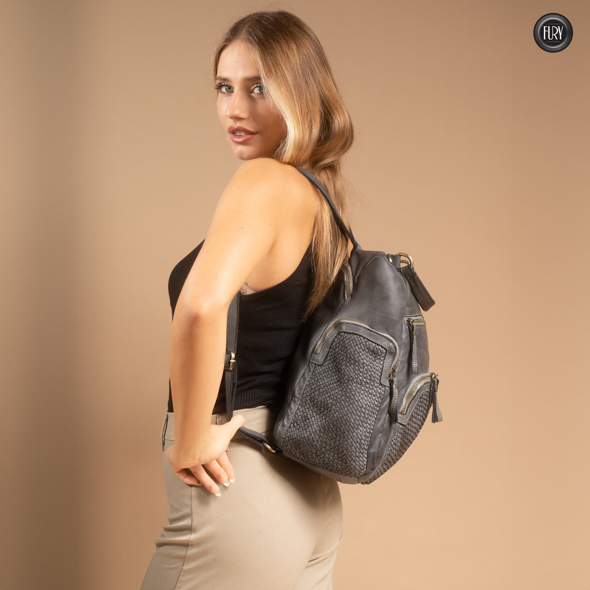 Multi-pocket backpack in woven leather