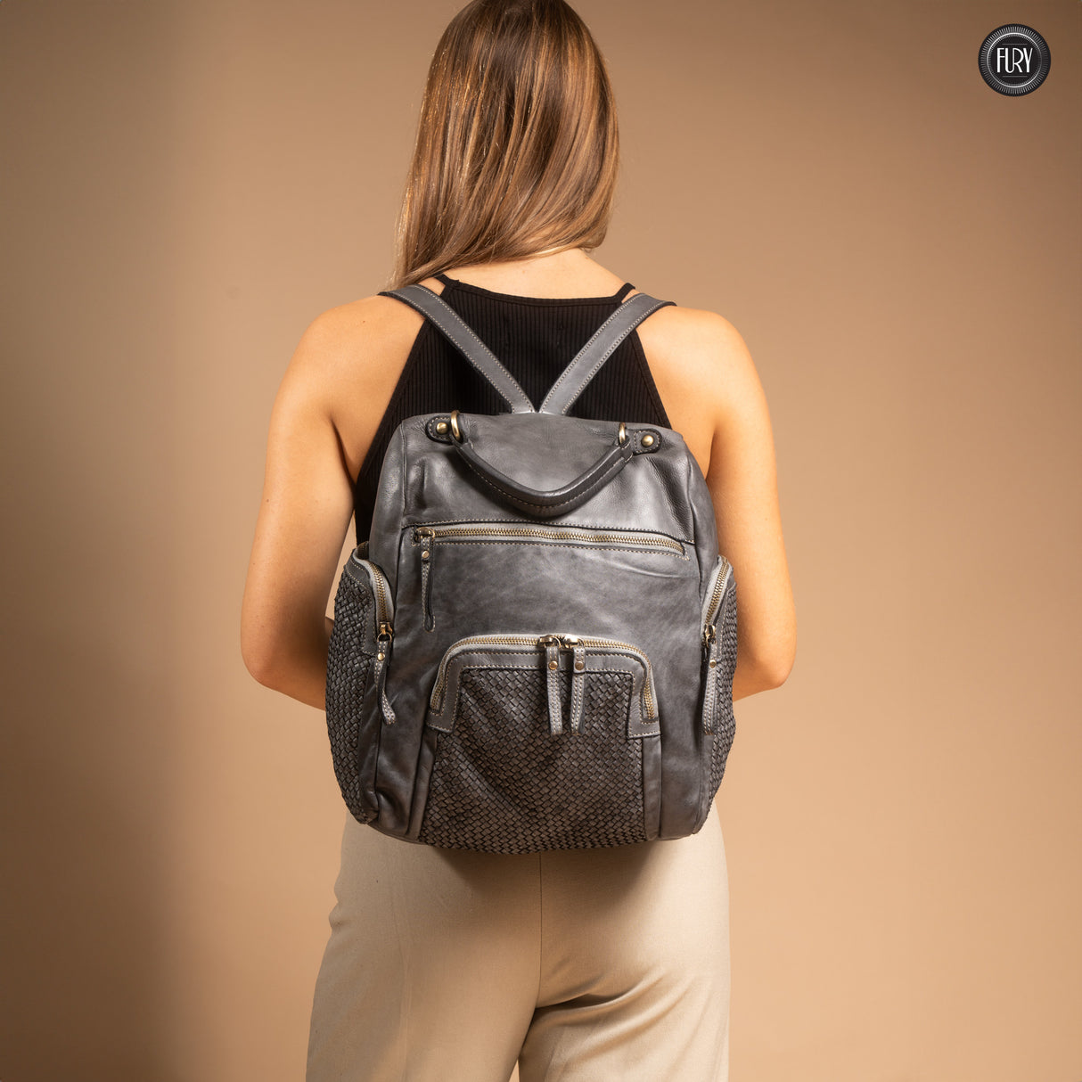 Multi-pocket backpack in woven leather