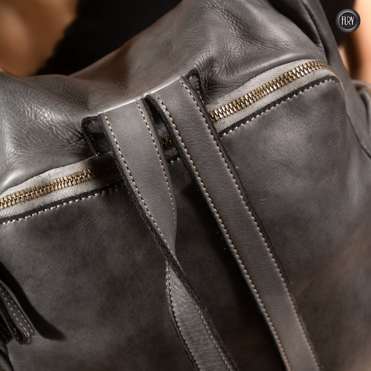 Multi-pocket backpack in woven leather